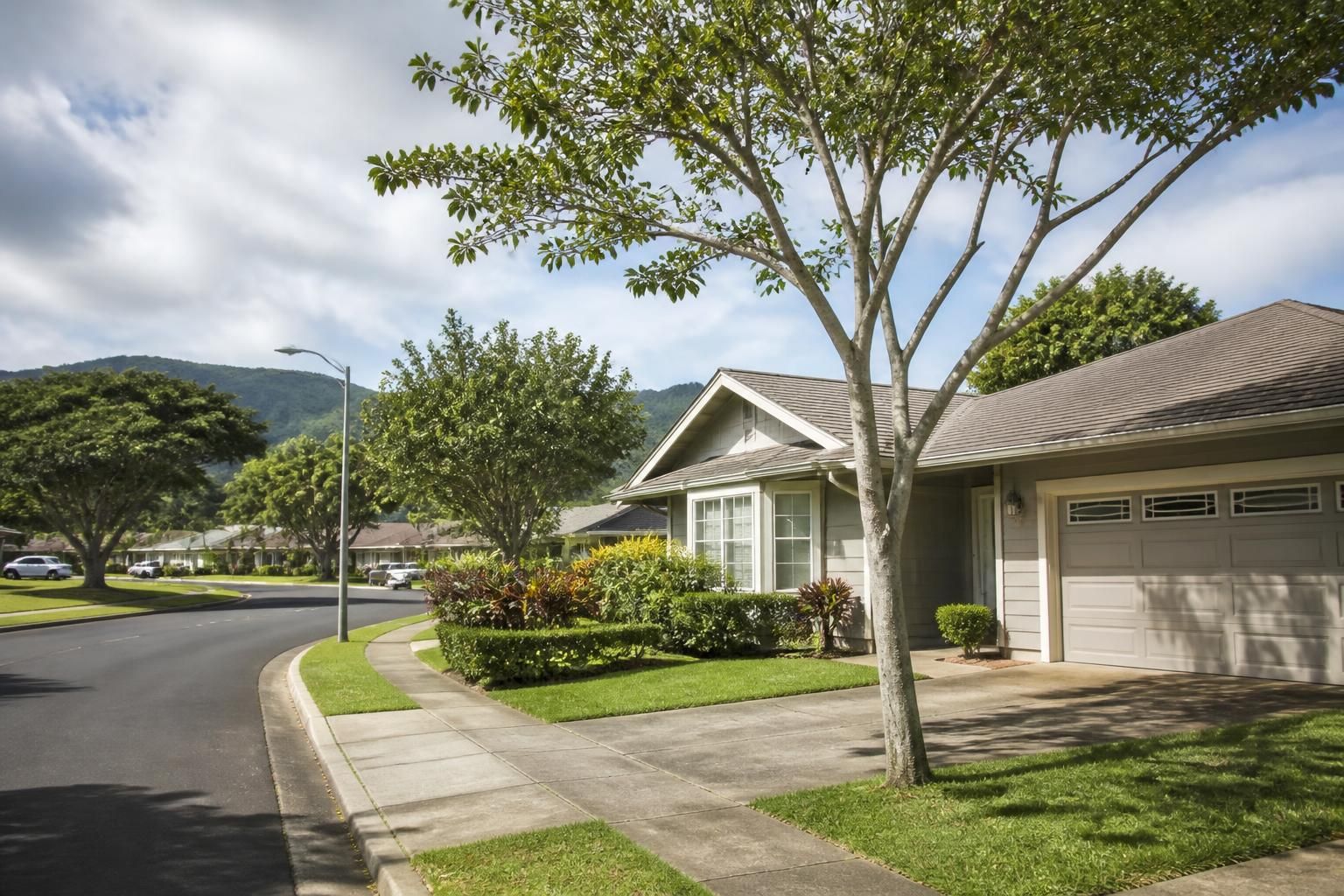 Neatly kept Mililani homes with mature trees and soft daylight.